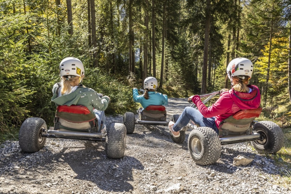 With the mountain cart over sticks and rocks